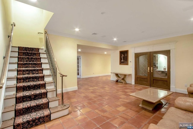 living room with light tile patterned flooring, ornamental molding, and french doors