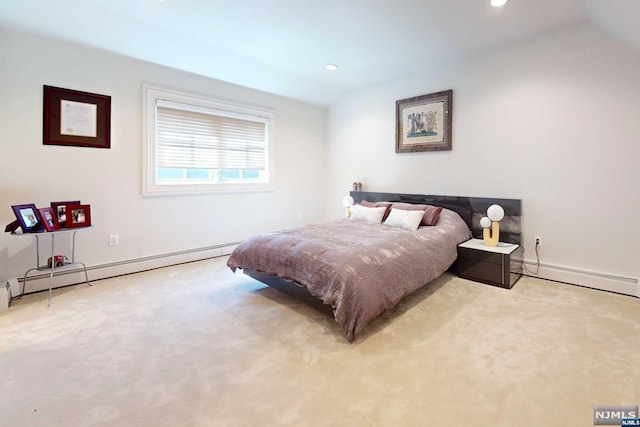 carpeted bedroom featuring a baseboard radiator and lofted ceiling