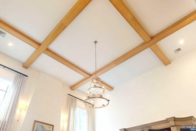 details featuring beamed ceiling and an inviting chandelier