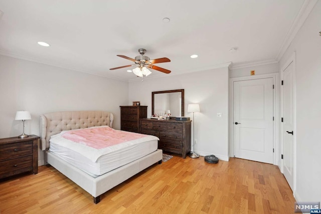 bedroom featuring light hardwood / wood-style flooring, ceiling fan, and ornamental molding