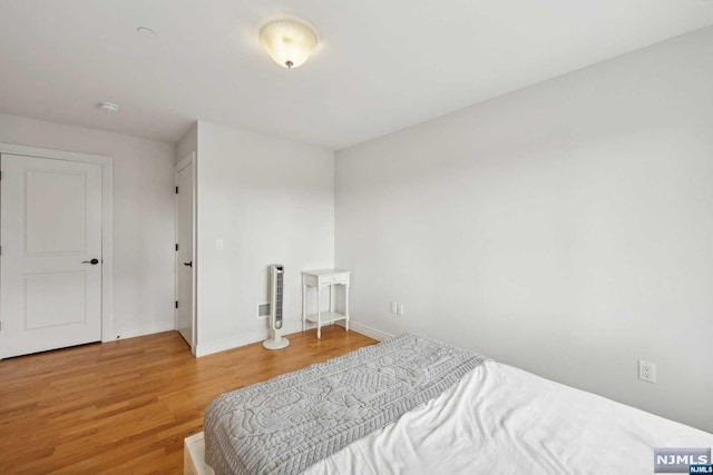 bedroom featuring hardwood / wood-style flooring