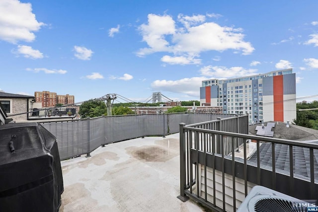 view of patio / terrace with a balcony, central AC, and grilling area