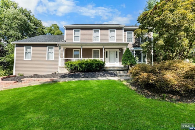 view of front of house featuring a front lawn and a porch