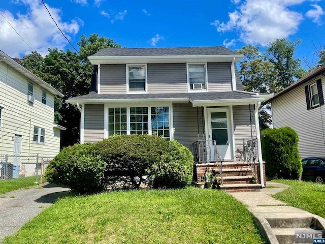 view of front of home with a front lawn