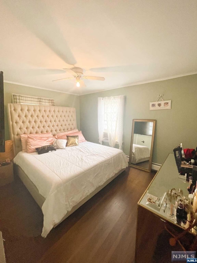 bedroom with ceiling fan, dark hardwood / wood-style floors, and crown molding