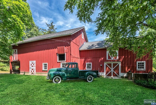 view of outdoor structure with a lawn