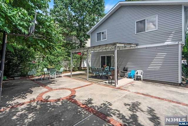 rear view of property featuring a patio area