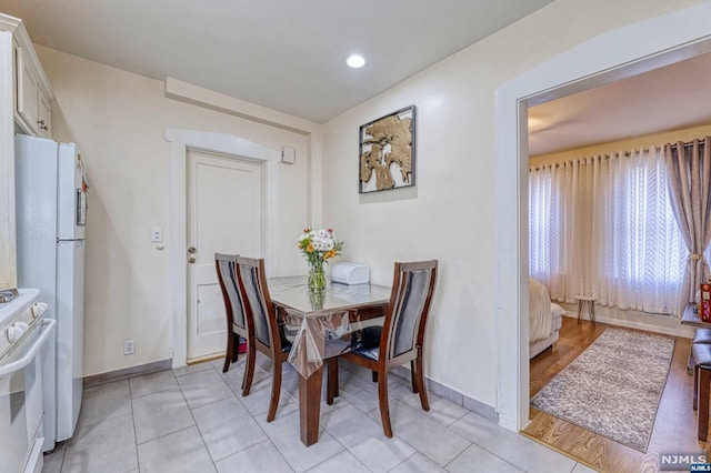 dining area with light hardwood / wood-style flooring