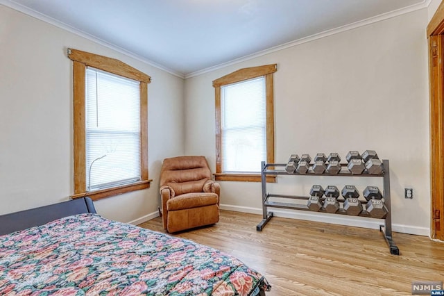 bedroom featuring hardwood / wood-style floors and ornamental molding