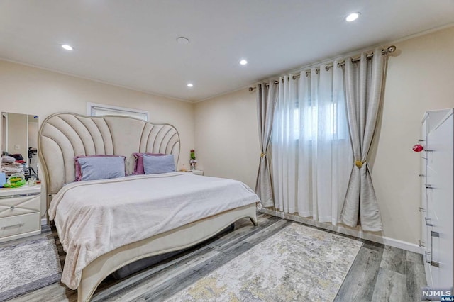 bedroom with wood-type flooring