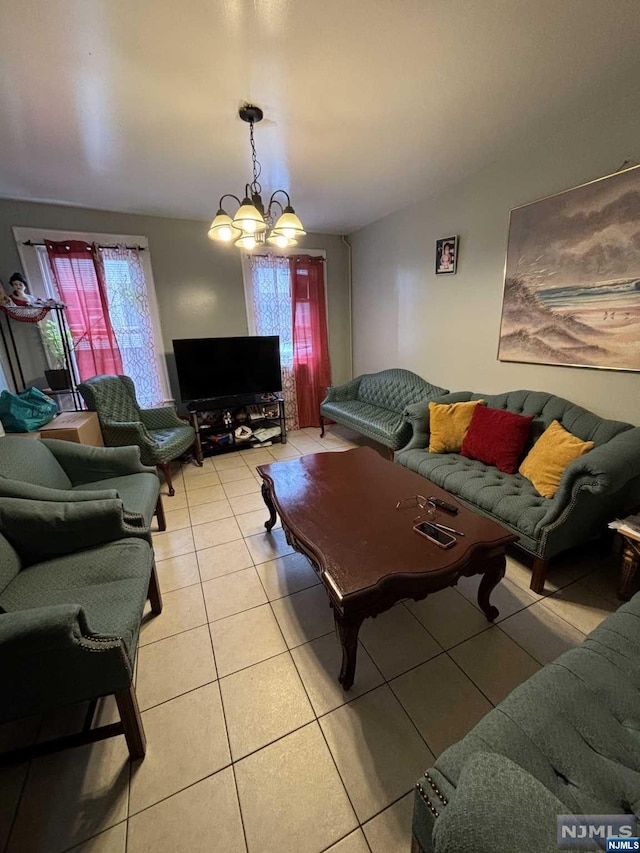 tiled living room with a notable chandelier and vaulted ceiling