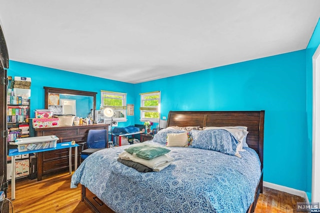 bedroom featuring hardwood / wood-style flooring