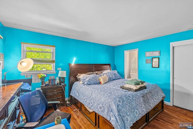 bedroom featuring wood-type flooring