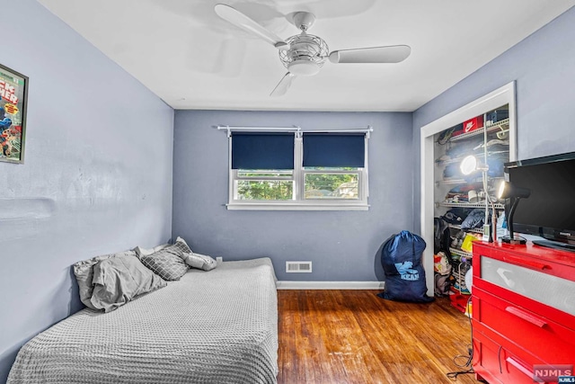 bedroom with hardwood / wood-style flooring and ceiling fan