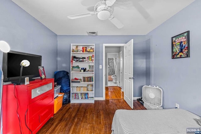 bedroom featuring ceiling fan and dark wood-type flooring