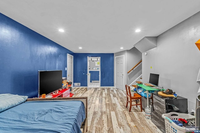 bedroom with wood-type flooring