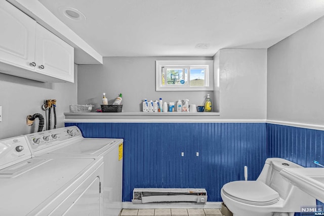 laundry room featuring washer and dryer, light tile patterned floors, and sink