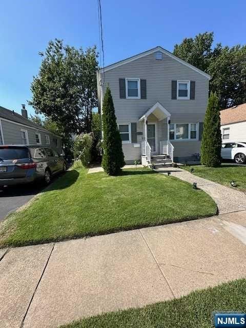 view of front of home with a front yard