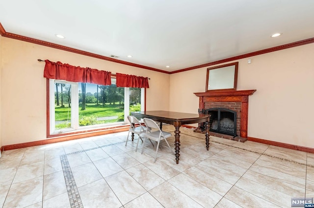 tiled dining space with a brick fireplace and ornamental molding