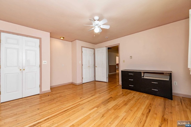 bedroom with ceiling fan and light wood-type flooring