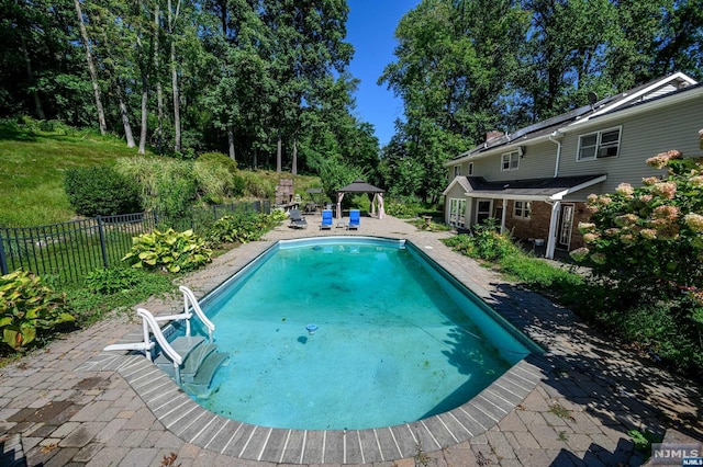 view of pool with a gazebo and a water slide