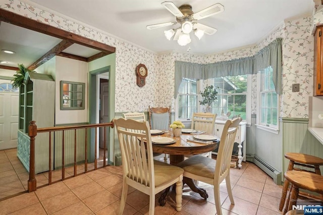 dining room with baseboard heating, ceiling fan, and light tile patterned floors