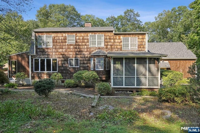 back of property featuring a sunroom