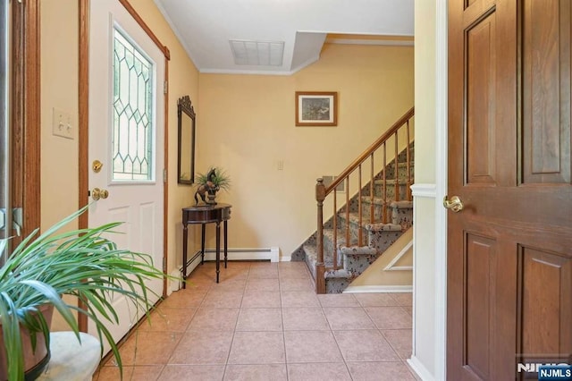 entrance foyer with light tile patterned flooring, baseboard heating, and crown molding