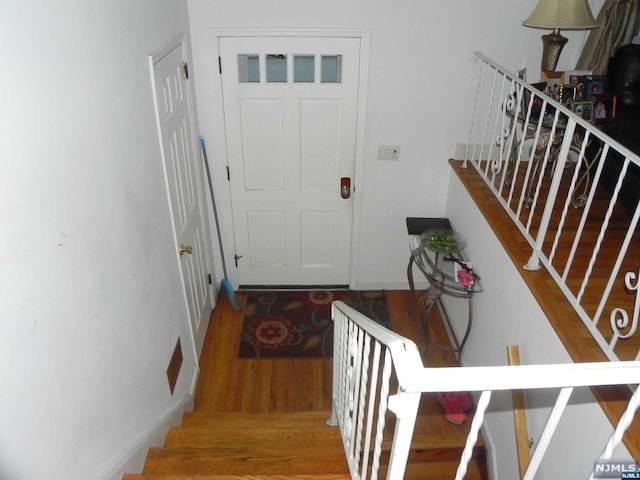 entrance foyer featuring hardwood / wood-style floors