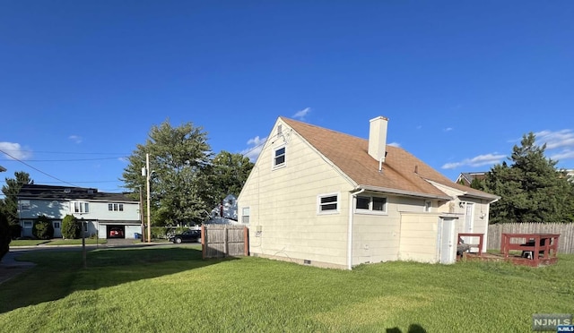 view of property exterior with a lawn