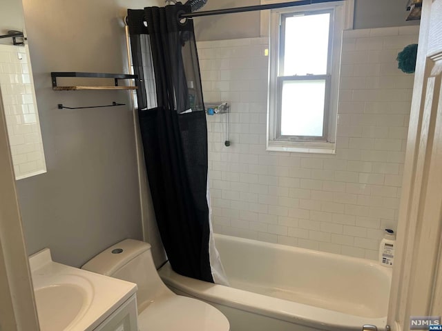 full bathroom featuring shower / bath combo with shower curtain, vanity, and toilet