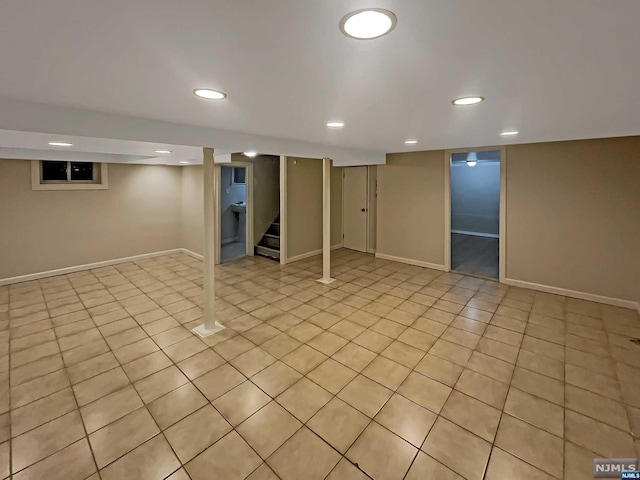 basement featuring light tile patterned floors