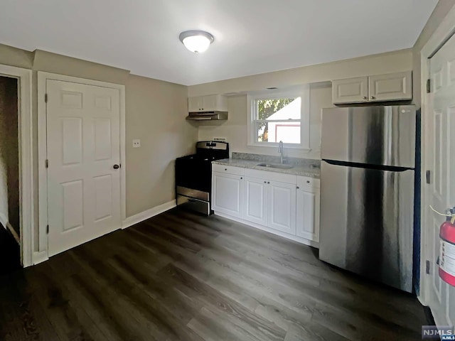 kitchen featuring dark wood-type flooring, white cabinets, sink, range, and stainless steel refrigerator