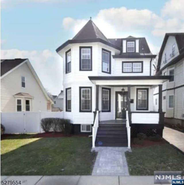 view of front of house featuring a front lawn and a porch