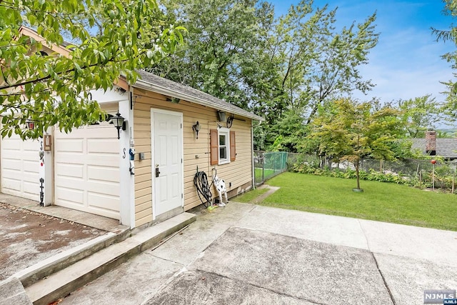 view of outbuilding with a yard