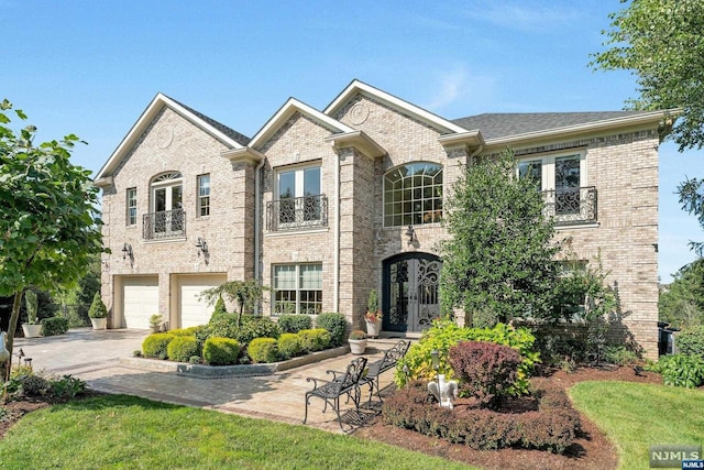 view of front facade featuring french doors and a garage