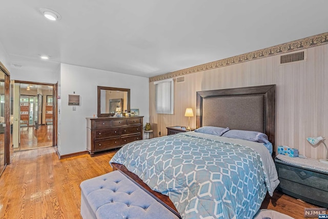 bedroom with light hardwood / wood-style floors