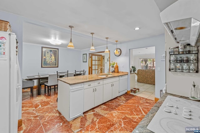 kitchen featuring white appliances, crown molding, sink, pendant lighting, and white cabinetry