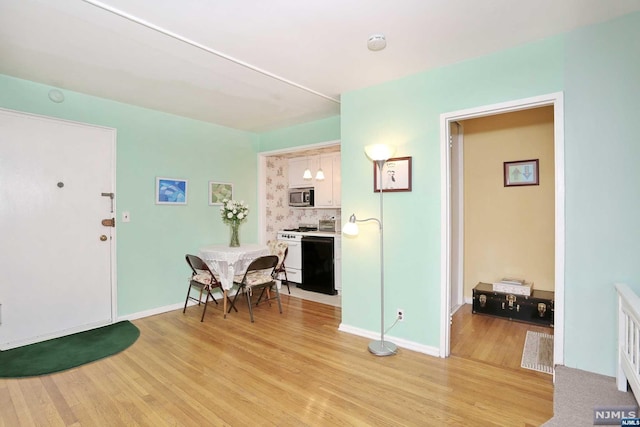 dining area featuring light wood-type flooring