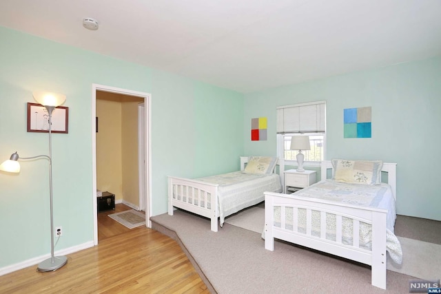 bedroom with light hardwood / wood-style flooring