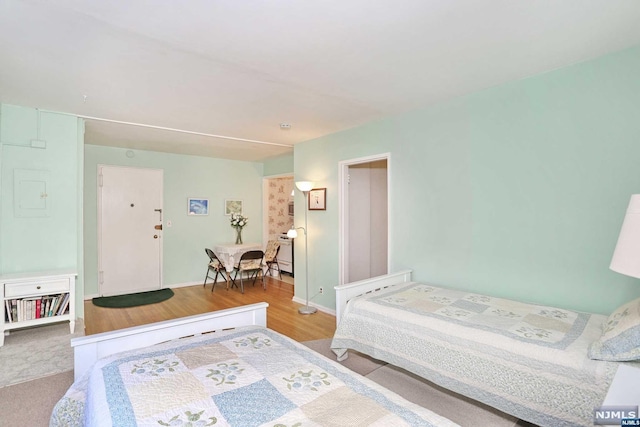 bedroom with light hardwood / wood-style floors