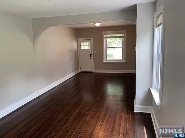 entrance foyer featuring dark hardwood / wood-style flooring