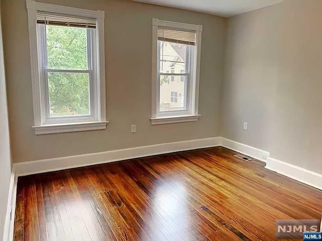 empty room featuring hardwood / wood-style floors