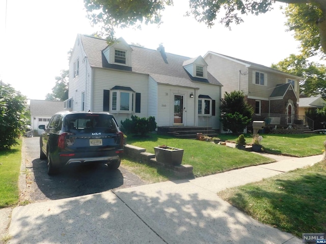 new england style home with a front yard