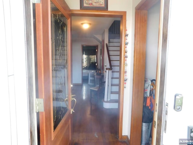 hallway with dark hardwood / wood-style floors