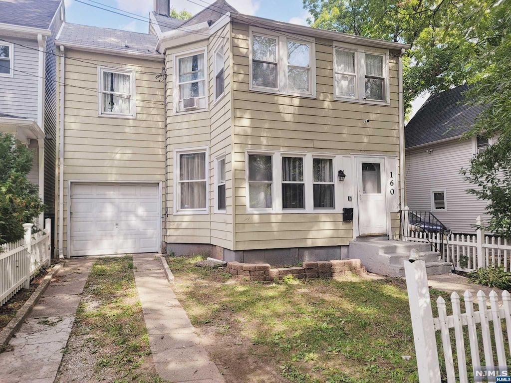 view of front of property featuring a garage