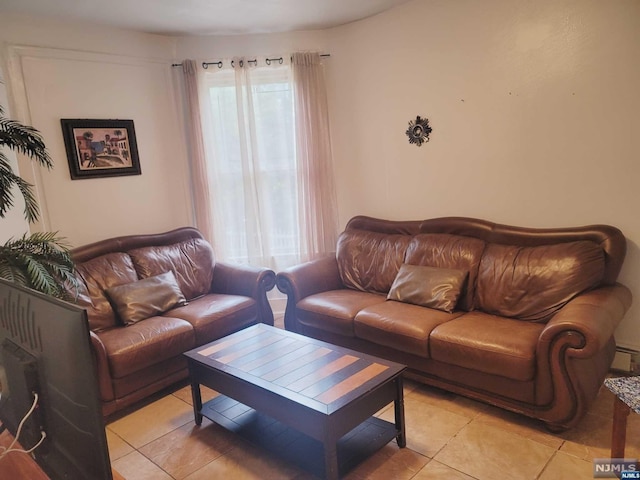 living room featuring plenty of natural light and light tile patterned flooring