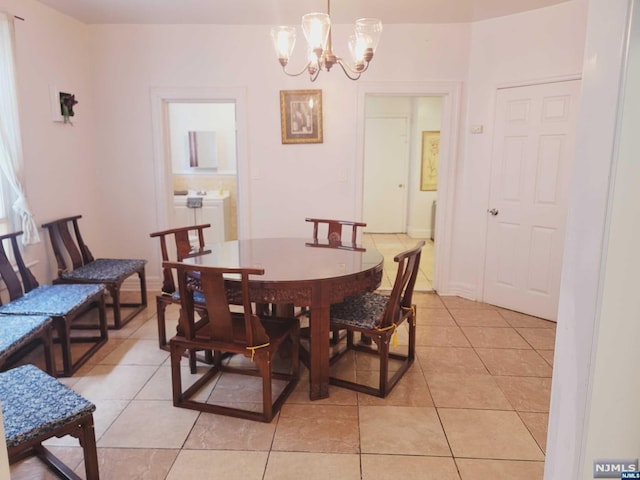 tiled dining area with a notable chandelier