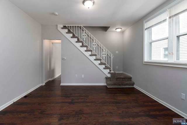 stairway with wood-type flooring