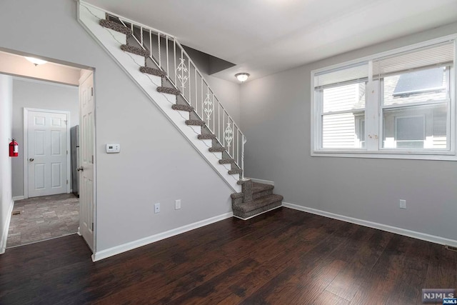 stairs with wood-type flooring